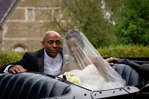 wedding photography Wedding Photography of a bride and groom sitting in a vintage car at Orchardleigh.