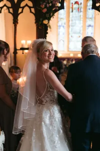 A bride walks down the aisle with her father at Orchardleigh House, captured in breathtaking photos.