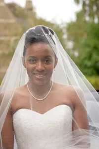wedding photography A bride in a wedding dress sitting in a car during Orchardleigh wedding photography.