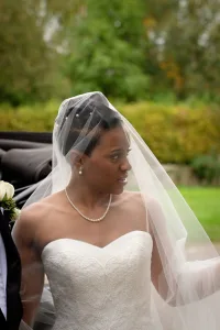 wedding photography Wedding Photography of a bride and groom standing next to a car at Orchardleigh.