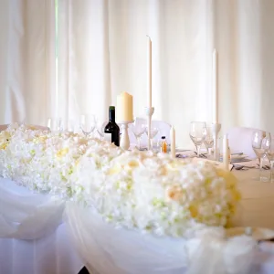 wedding photography Orchardleigh Wedding Photography captured the beautifully adorned wedding table, embellished with white flowers and candles.