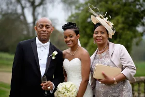 wedding photography Orchardleigh Wedding Photography captures a beautiful moment as a bride and her mother pose for a photo.