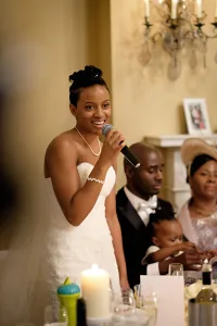 wedding photography A Wedding Photographer captures the woman speaking into a microphone at Orchardleigh.