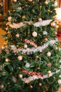 A Christmas tree adorned with gold and silver ornaments in Orchardleigh House.