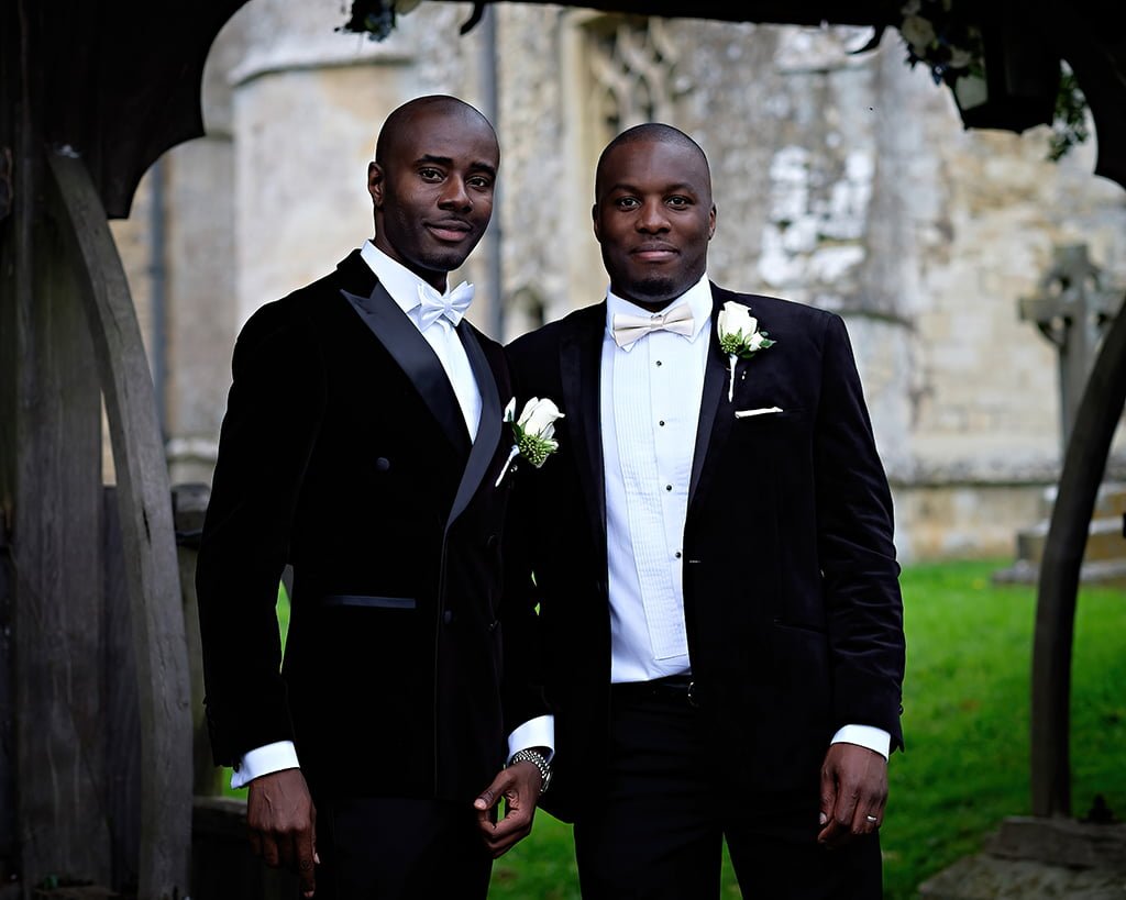 a couple of men standing next to each other.