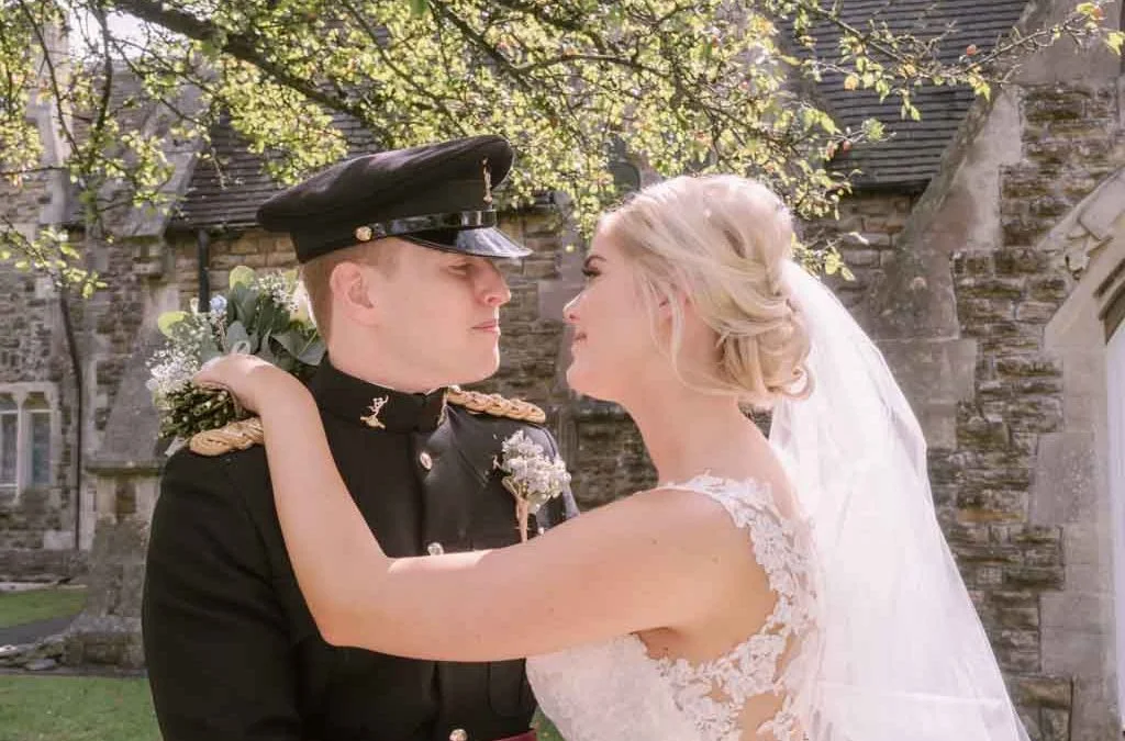 wedding photography a skill: a man in a military uniform and a woman in a wedding dress.