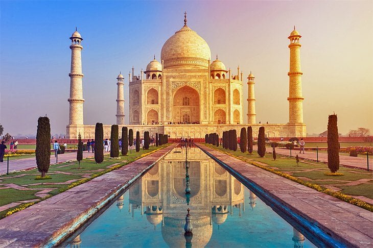 the taj mahal is reflected in the water.