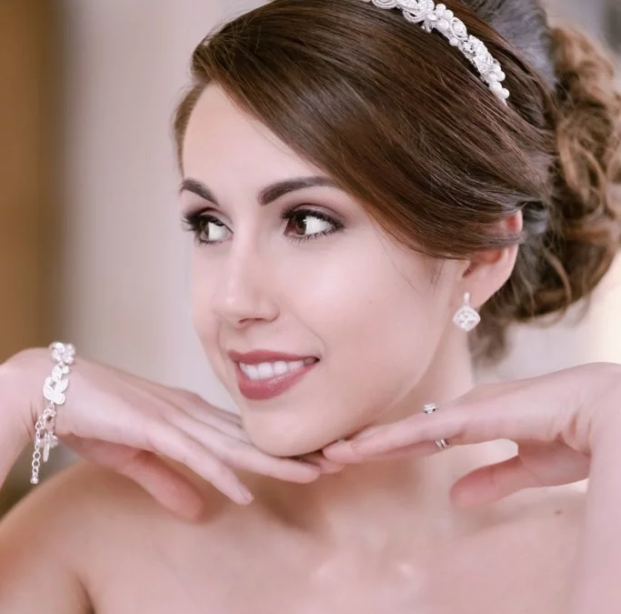 a woman in a wedding dress posing for a picture.