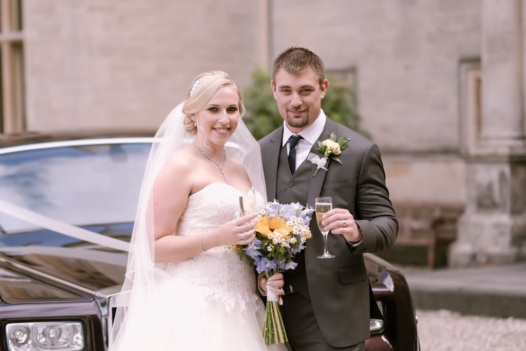 Selection Wedding Vendors: a bride and groom standing in front of a car.