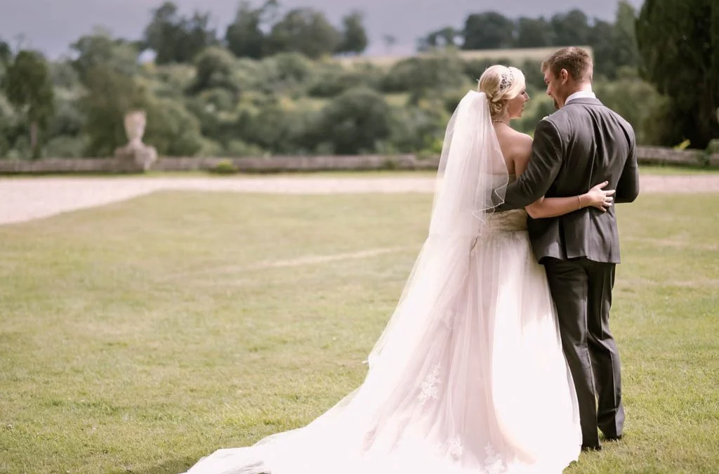 Bride and groom on a lawn