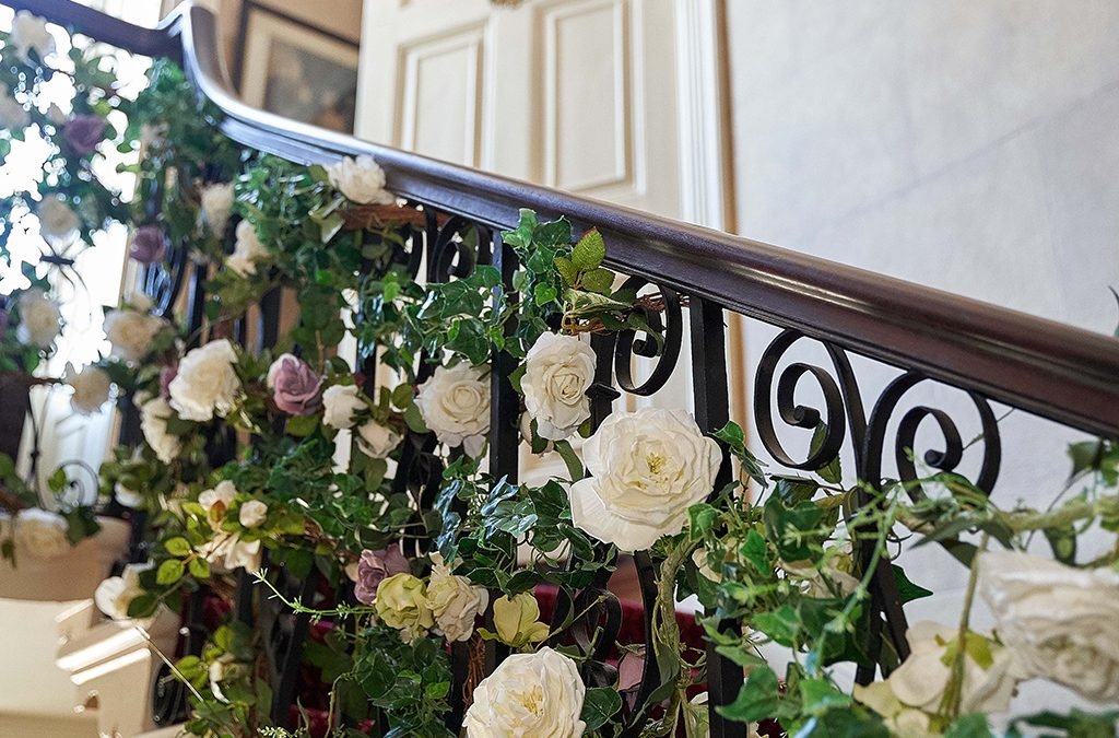 a staircase with a bunch of flowers on it.