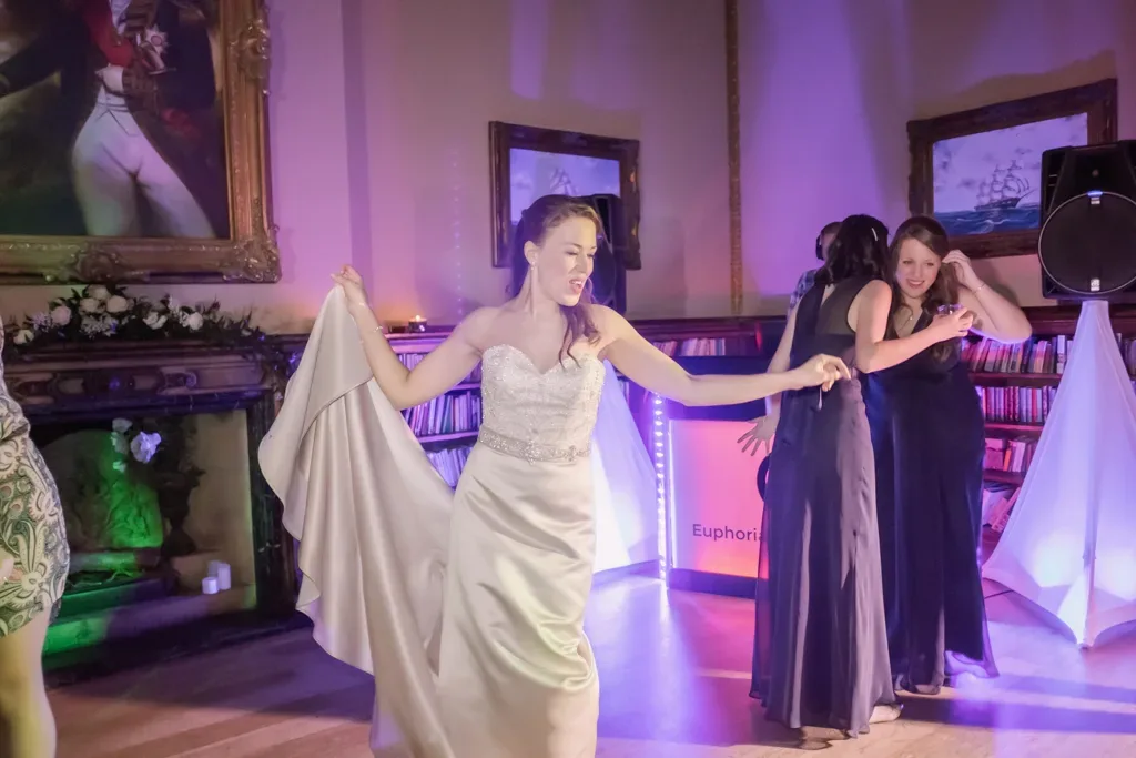Bride at Orchardleigh House: a bride and her bridesmaids dancing on the dance floor.