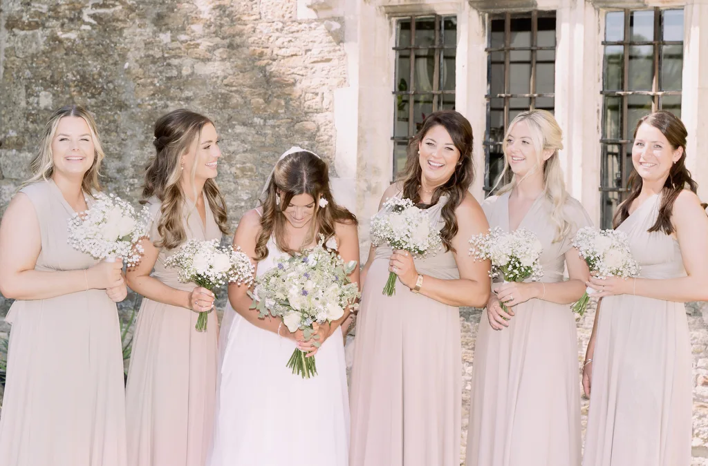 Orchardleigh Wedding Photos: a group of women standing next to each other.