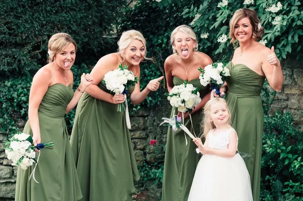 Lullington Church Wedding Photographer: a group of women standing next to each other.