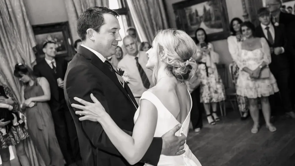 a bride and groom dance together at their wedding reception.