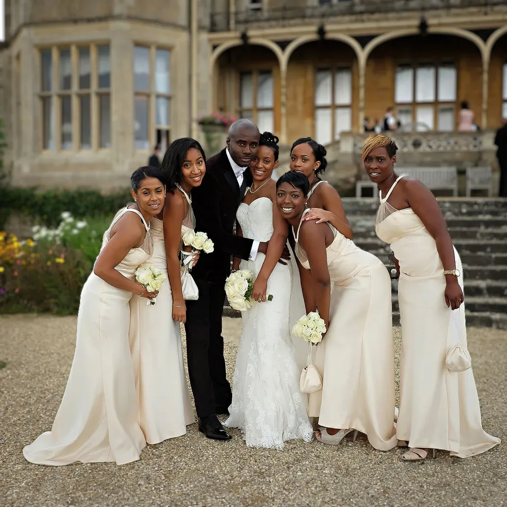 Orchardleigh House Wedding Photographer: a group of people standing next to each other in front of a building.