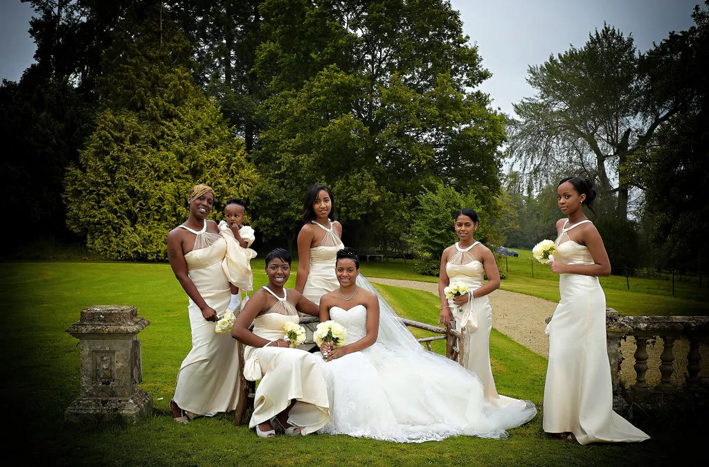 a group of bridesmaids posing for a picture.