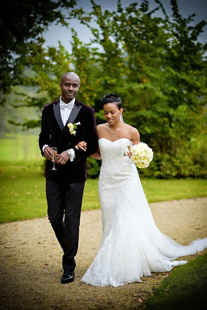 Receiving lines: a bride and groom walking down a path.