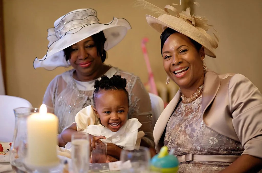 Mother of the Bride: two women and a baby sitting at a table.