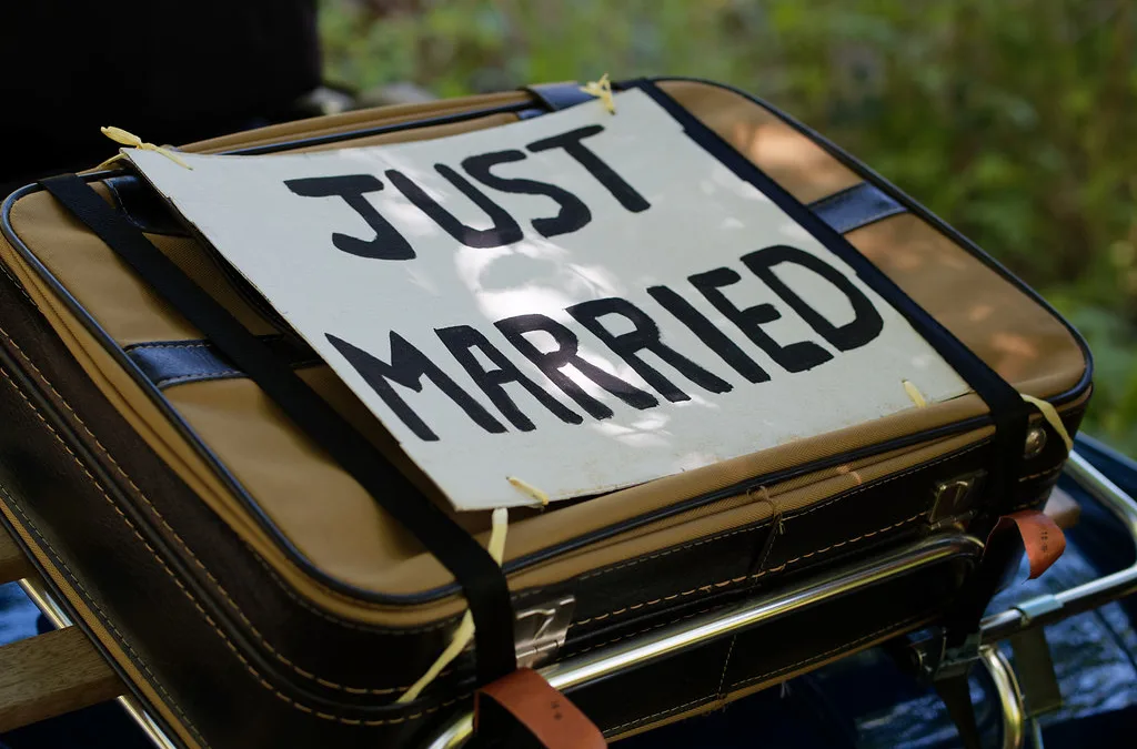 a suitcase with a sign that says just married. Elmhay Park