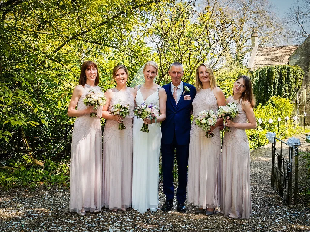 Recommended Wedding Photographer Orchardleigh House: a group of people standing next to each other.