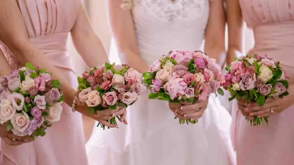 PhotoJournalism Photographer: Wedding Industry :a group of bridesmaids holding bouquets of flowers.