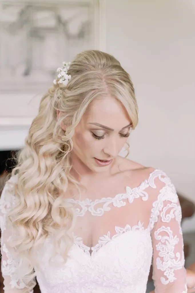Bailbrook weddings: a woman with long blonde hair wearing a wedding dress.