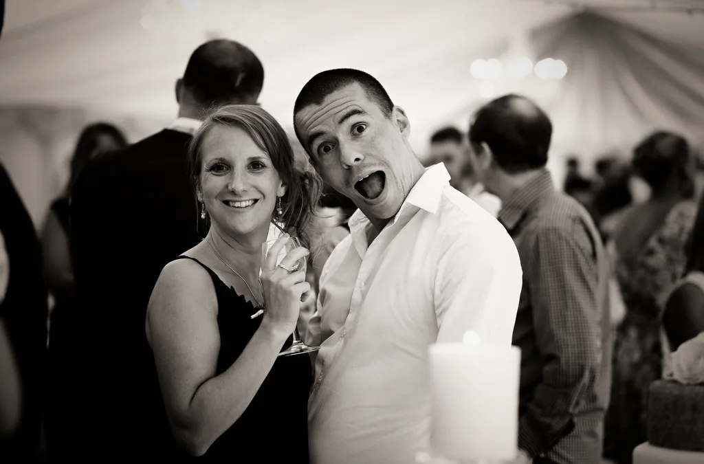 Laugh on the wedding day: making your wedding fun: a man and a woman standing next to each other.