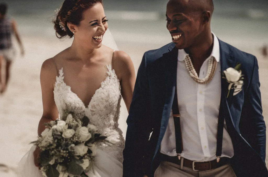 Caribbean Weddings: a bride and groom walking on the beach.