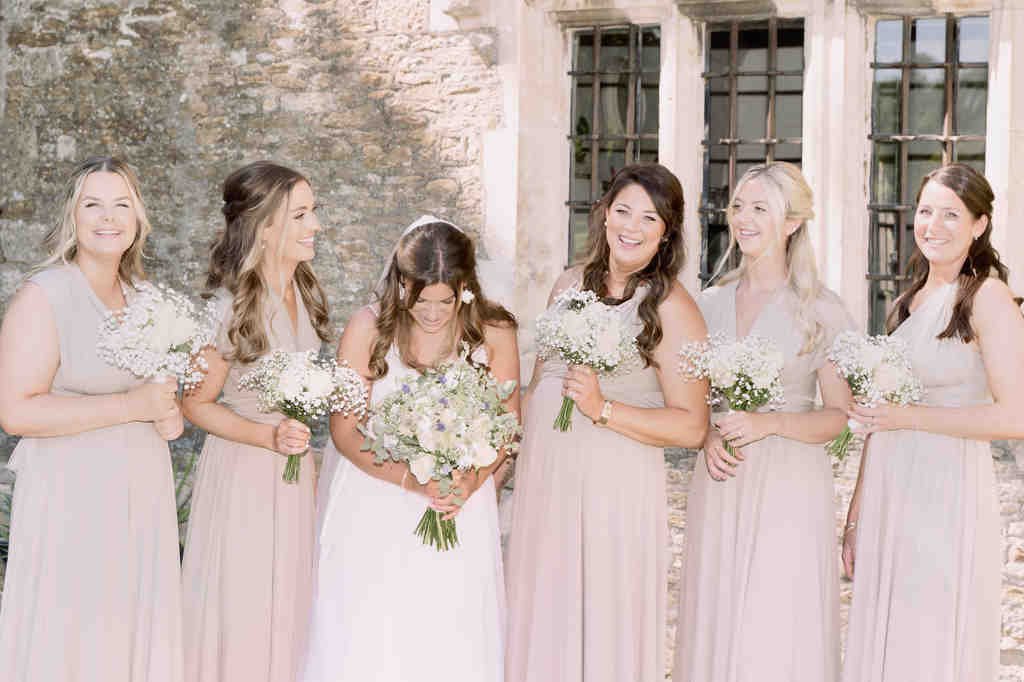 a group of women standing next to each other. Seymours Court Wedding Photographer