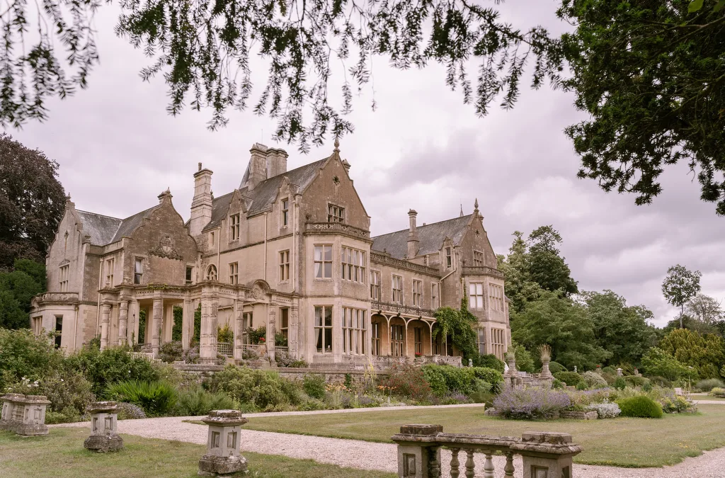 Orchardleigh House: a large mansion in the middle of a lush garden.