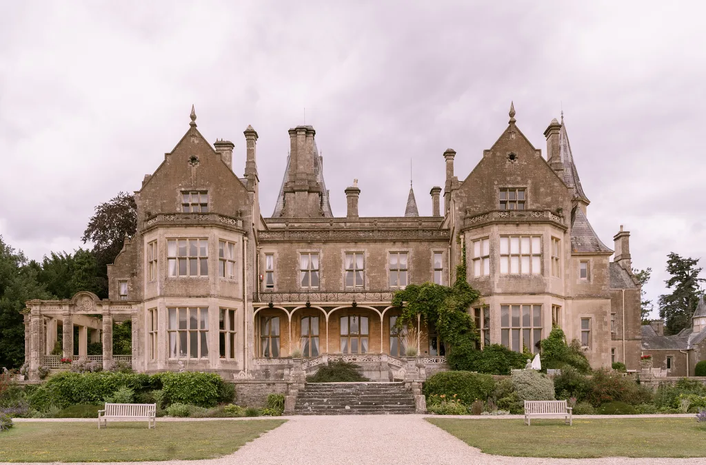 Orchardleigh House: an ornate mansion in the middle of a lush green garden.