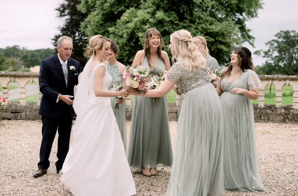 A Castle Combe Manor wedding photographer capturing the bride and her bridesmaids on their special day.
