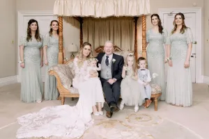 A bride and her bridesmaids pose for a photo at Orchardleigh House.