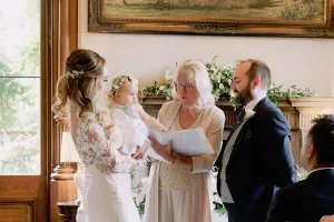 A bride and groom exchange vows at Orchardleigh House, captured by a skilled wedding photographer.