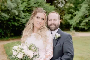 A bride and groom posing for a photo in Orchardleigh House.