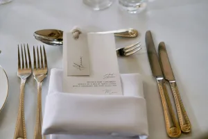 A beautiful table setting at Orchardleigh House with a napkin, fork, and knife.