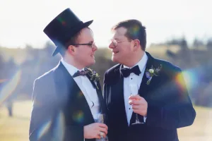 _DSF7852 Two gay men in tuxedos and top hats captured beautifully by Orchardleigh Wedding Photography.