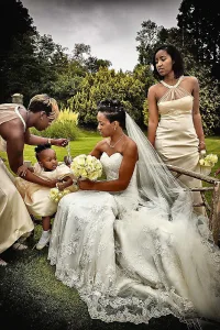 A bride and her bridesmaids are posing for a picture. Orchardleigh House Wedding Photographer