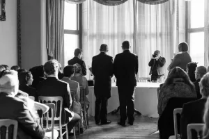 Orchardleigh Wedding Photography captures a black and white photo of a wedding ceremony.