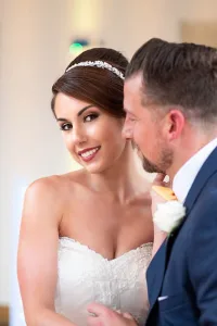 A Farleigh House wedding photographer captures a man and woman smiling.