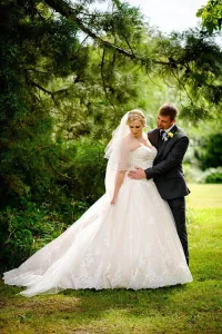 A man and woman in a wedding dress captured by Farleigh House Wedding Photographer.