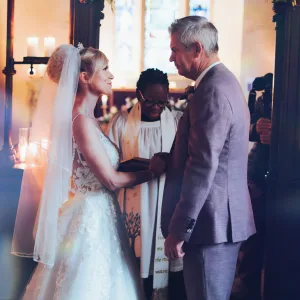 A bride and groom exchanging vows in Orchardleigh House.