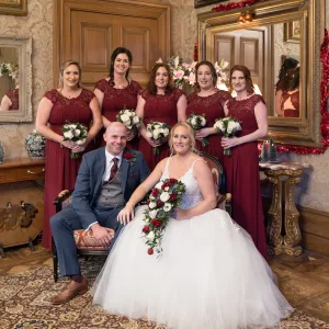 The Wedding Photographer captures a bride and her bridesmaids posing in front of a mirror at Orchardleigh.