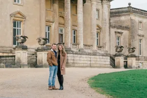 Stourhead Wedding Photographer25 Stourhead Wedding Photographer captures a couple in front of a grand mansion.