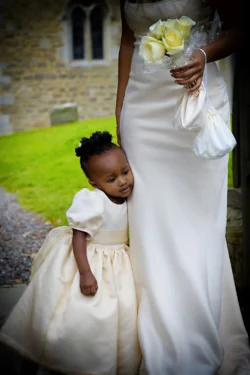 www.thefxworks.co.uk An elegant bride in a white dress holding a beautiful flower, captured in stunning Orchardleigh wedding photography.