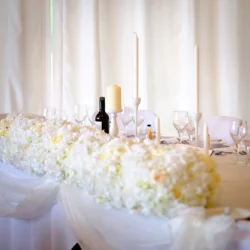 www.thefxworks.co.uk Orchardleigh Wedding Photography captured the beautifully adorned wedding table, embellished with white flowers and candles.