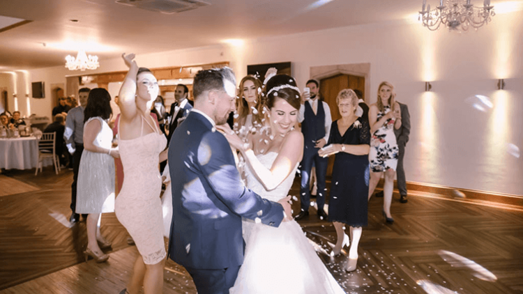 a bride and groom are dancing on the dance floor.