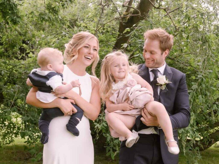 Seymours court Frome: Wedding Photography: a couple of people that are holding some babies.