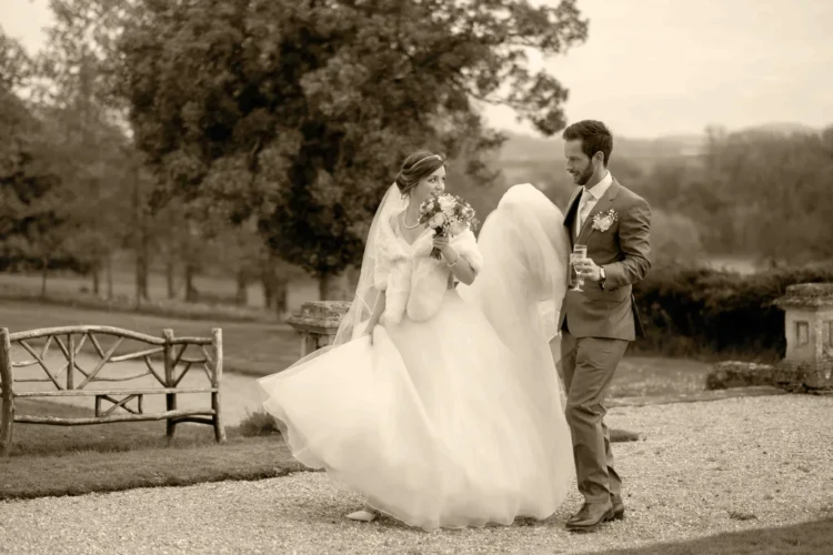 We got married in Frome:a bride and groom walking together in a park near Wick Farm Bath Orchardleigh Wedding Photographer